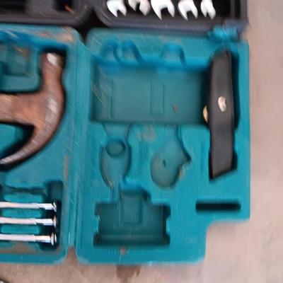 Two incomplete tool kits in organizing boxes -