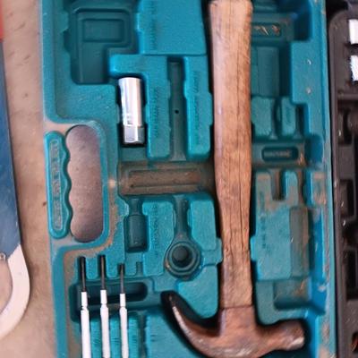 Two incomplete tool kits in organizing boxes -