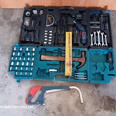 Two incomplete tool kits in organizing boxes -