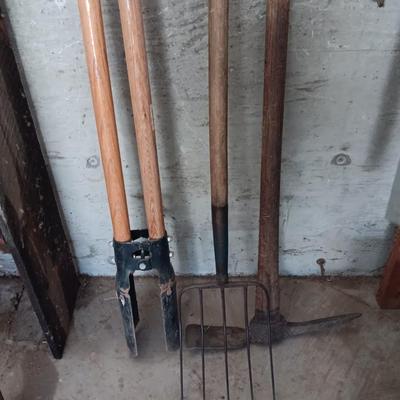 Post hole digger - pick ax - and nice pitchfork AKA WORK.