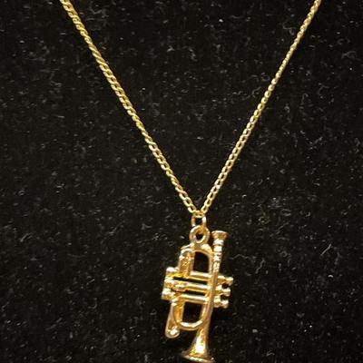 Small trumpet charm necklace