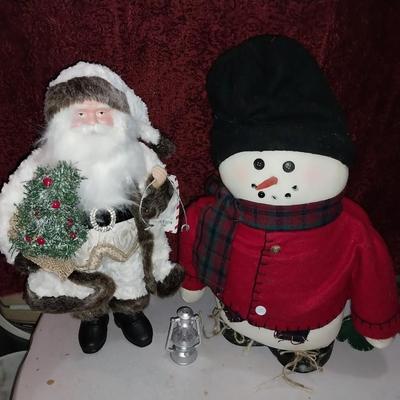 NORTH POLE SANTA AND A WEIGHTED SNOWMAN