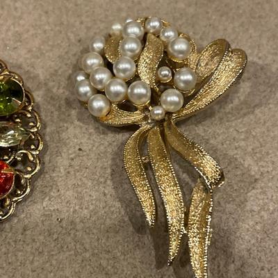 3 gold tone brooches