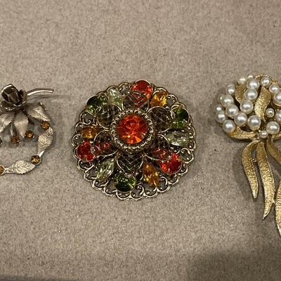 3 gold tone brooches