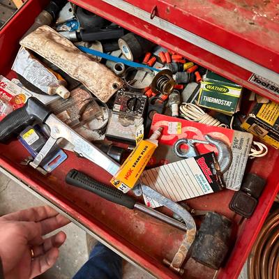 Metal toolbox containing miscellaneous tools