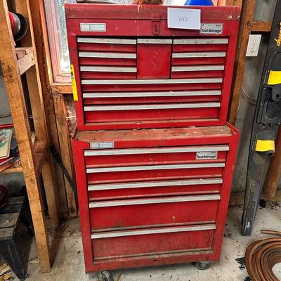 Metal toolbox containing miscellaneous tools