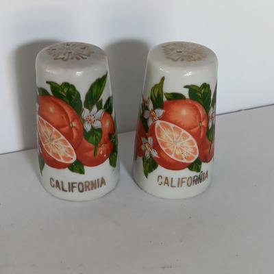 Vintage Salt & Pepper shakers from California - wooden with gold-colored holders and Oranges