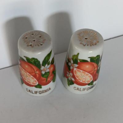 Vintage Salt & Pepper shakers from California - wooden with gold-colored holders and Oranges