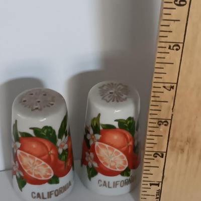 Vintage Salt & Pepper shakers from California - wooden with gold-colored holders and Oranges