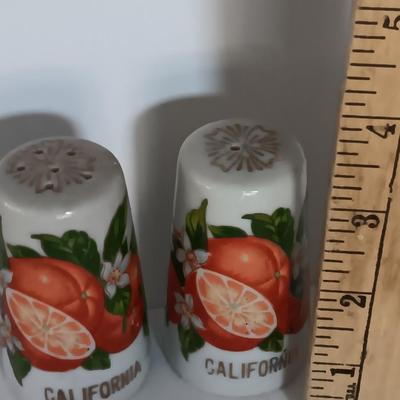 Vintage Salt & Pepper shakers from California - wooden with gold-colored holders and Oranges