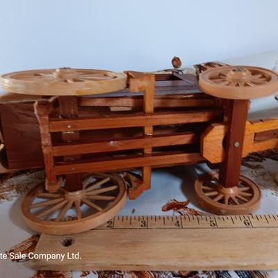 Vintage wooden covered wagon with horse team and wild west cowboy fabric