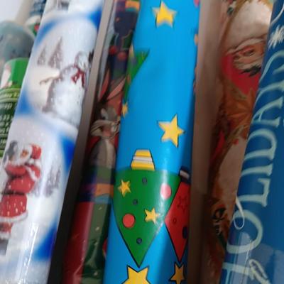 Several rolls of Christmas wrapping paper