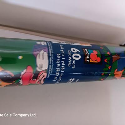 Several rolls of Christmas wrapping paper