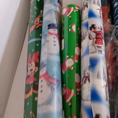 Several rolls of Christmas wrapping paper