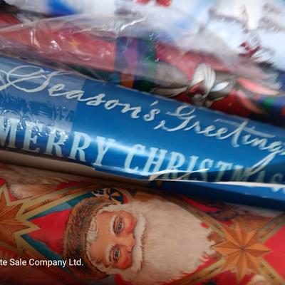 Several rolls of Christmas wrapping paper