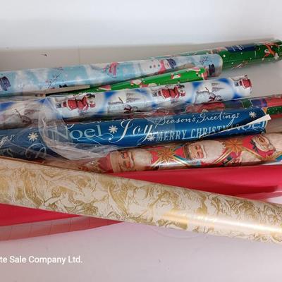 Several rolls of Christmas wrapping paper