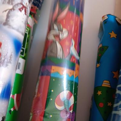 Several rolls of Christmas wrapping paper