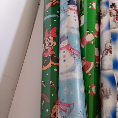 Several rolls of Christmas wrapping paper