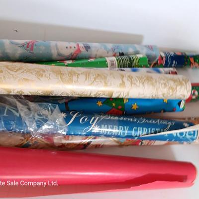 Several rolls of Christmas wrapping paper