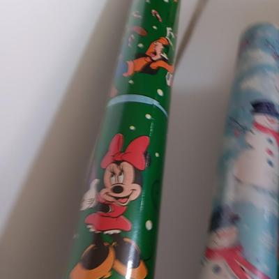 Several rolls of Christmas wrapping paper