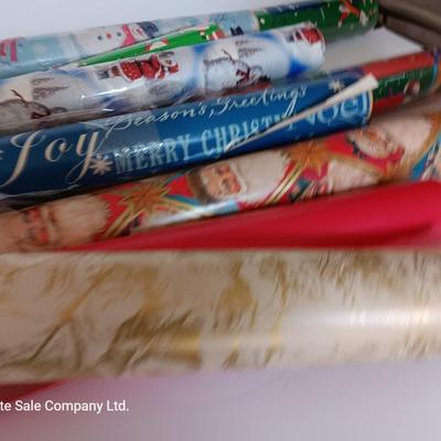 Several rolls of Christmas wrapping paper