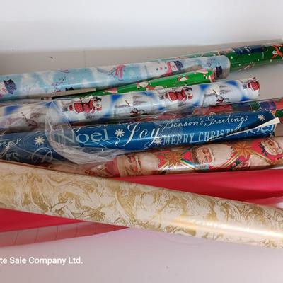Several rolls of Christmas wrapping paper