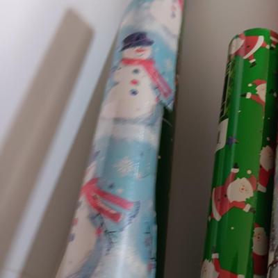 Several rolls of Christmas wrapping paper