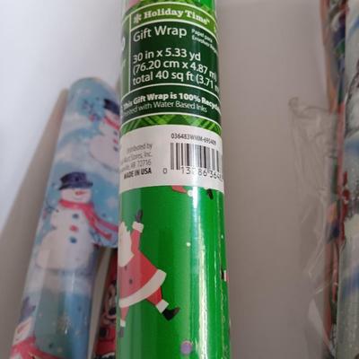 Several rolls of Christmas wrapping paper