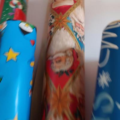 Several rolls of Christmas wrapping paper