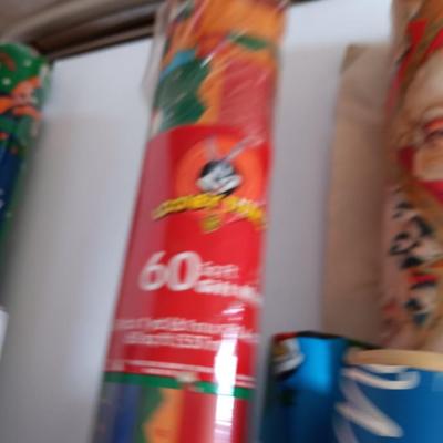 Several rolls of Christmas wrapping paper