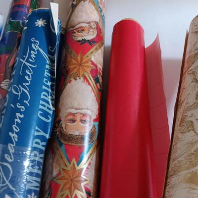 Several rolls of Christmas wrapping paper