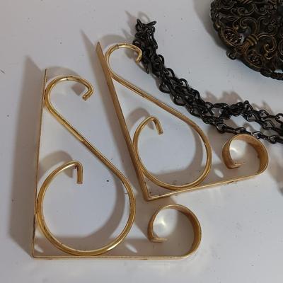 Vintage hardware for cabnitry with shelf hardware and a plastic decorative hanger