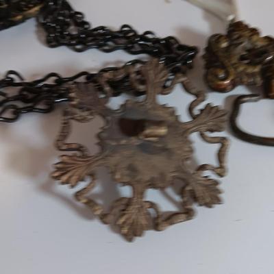 Vintage hardware for cabnitry with shelf hardware and a plastic decorative hanger