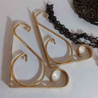 Vintage hardware for cabnitry with shelf hardware and a plastic decorative hanger