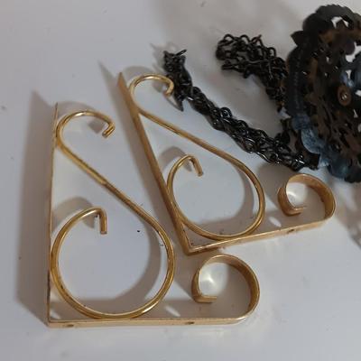 Vintage hardware for cabnitry with shelf hardware and a plastic decorative hanger