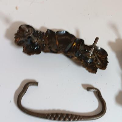Vintage hardware for cabnitry with shelf hardware and a plastic decorative hanger