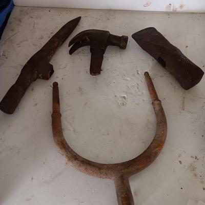 Antique heads to tools - hammer - prod - primitive pick - and ax