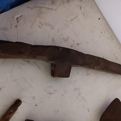 Antique heads to tools - hammer - prod - primitive pick - and ax