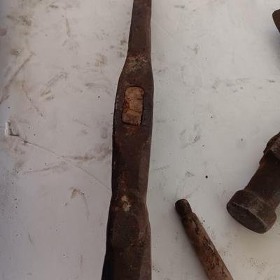 Antique heads to tools - hammer - prod - primitive pick - and ax