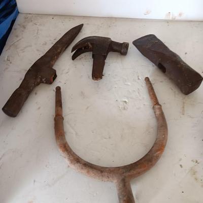 Antique heads to tools - hammer - prod - primitive pick - and ax