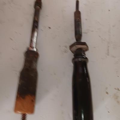 Two antique electric soldering irons with different sized heads