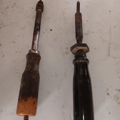 Two antique electric soldering irons with different sized heads