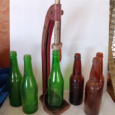Vintage bottle cork machine hand crank with vintage glass bottles