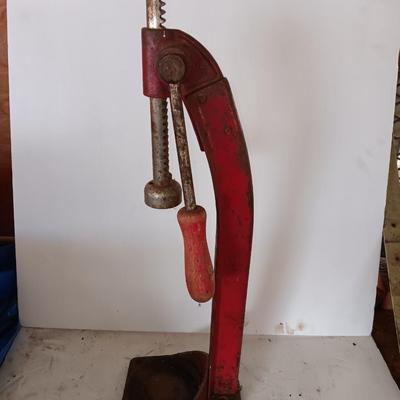 Vintage bottle cork machine hand crank with vintage glass bottles