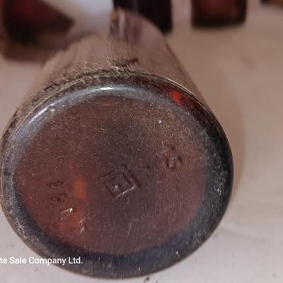 Vintage bottle cork machine hand crank with vintage glass bottles