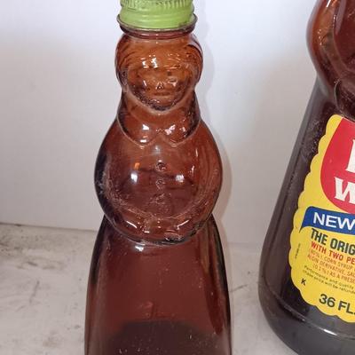 Three different sized Mrs. Butterworths bottles