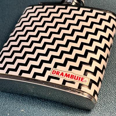 "DRAMBUIE" STAINLESS STEEL 5 0Z. FLASK WITH BLACK, WHITE ZIG ZAG PATTERN 