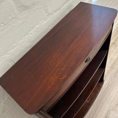 Vintage book stand with top shelf drawer.