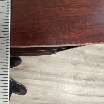 Vintage book stand with top shelf drawer.