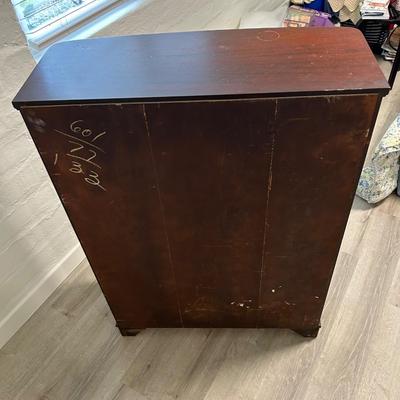 Vintage book stand with top shelf drawer.